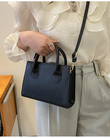 Elegant Black Handbag with Dual Handles