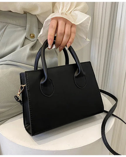 Elegant Black Handbag with Dual Handles