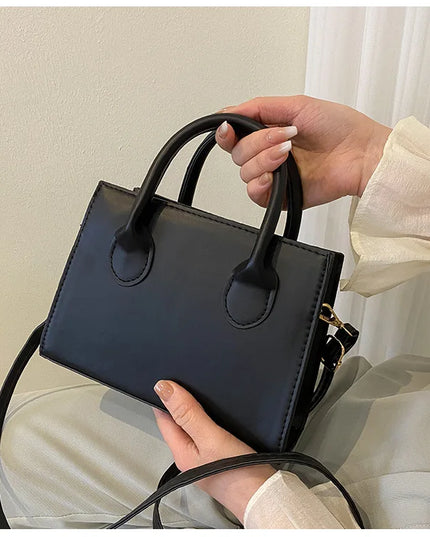 Elegant Black Handbag with Dual Handles