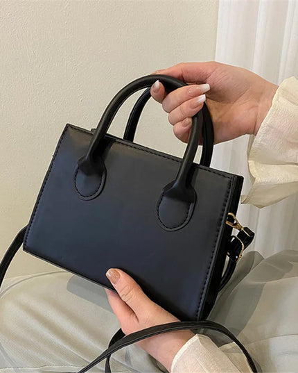 Elegant Black Handbag with Dual Handles