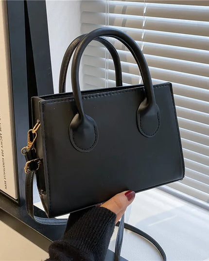Elegant Black Handbag with Dual Handles
