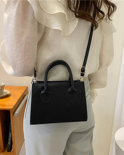 Elegant Black Handbag with Dual Handles